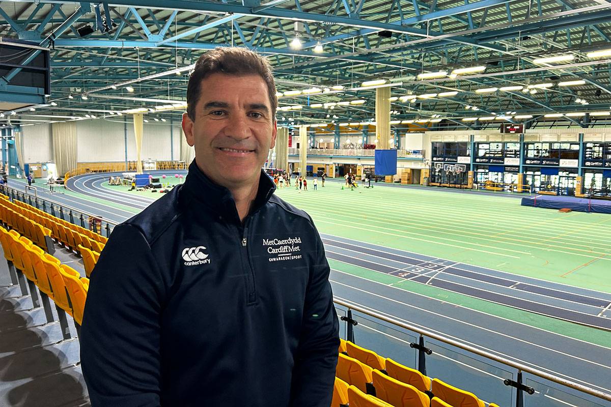 Gareth Baber stood in front of the indoor track at the National Indoor Athletics Centre