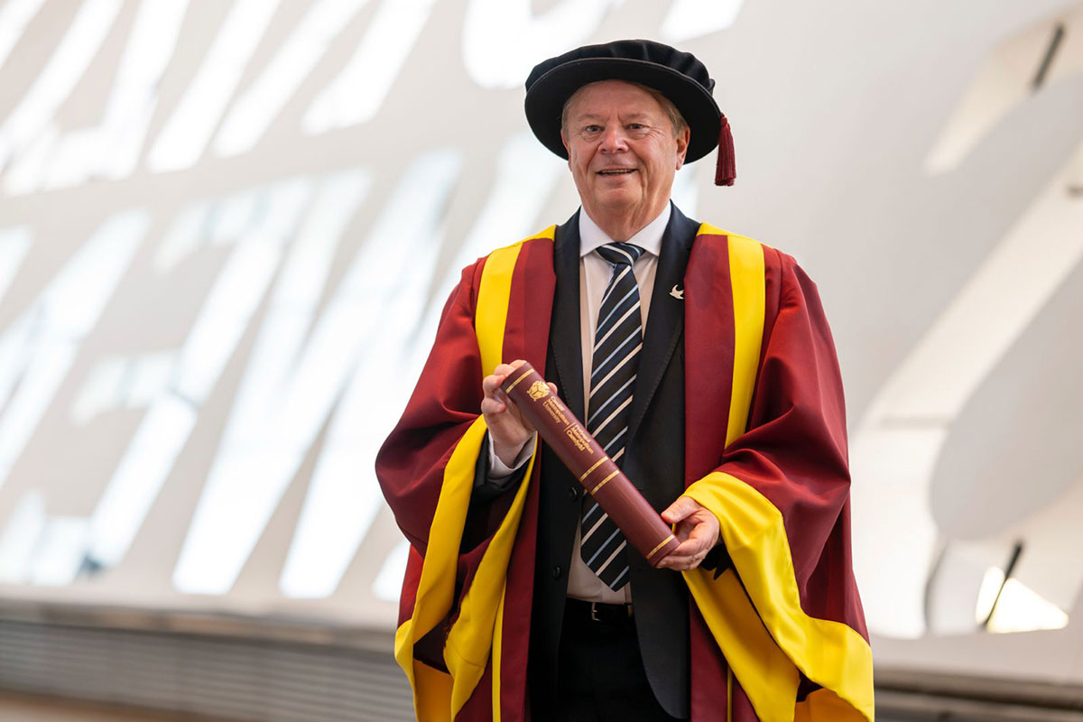 Steve Borley holding their Honorary Fellowship