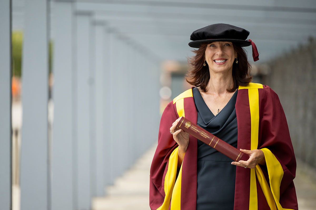 Trudy Norris-Grey holding their Honorary Fellowship