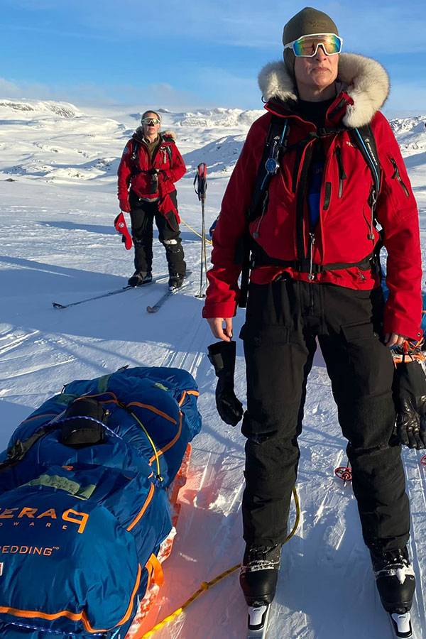 Georgina Gilbert and Rebecca Rowe pose for a photograph in the Antarctic landscape