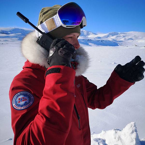 Georgina Gilbert using satellite phone during expedition