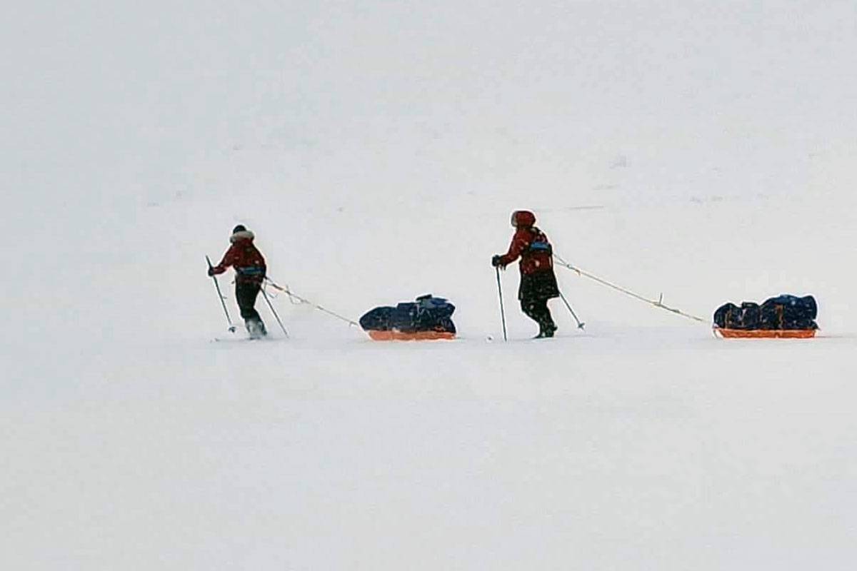 Georgina Gilbert and Rebecca Rowe traversing the Antarctic with their supply sleds