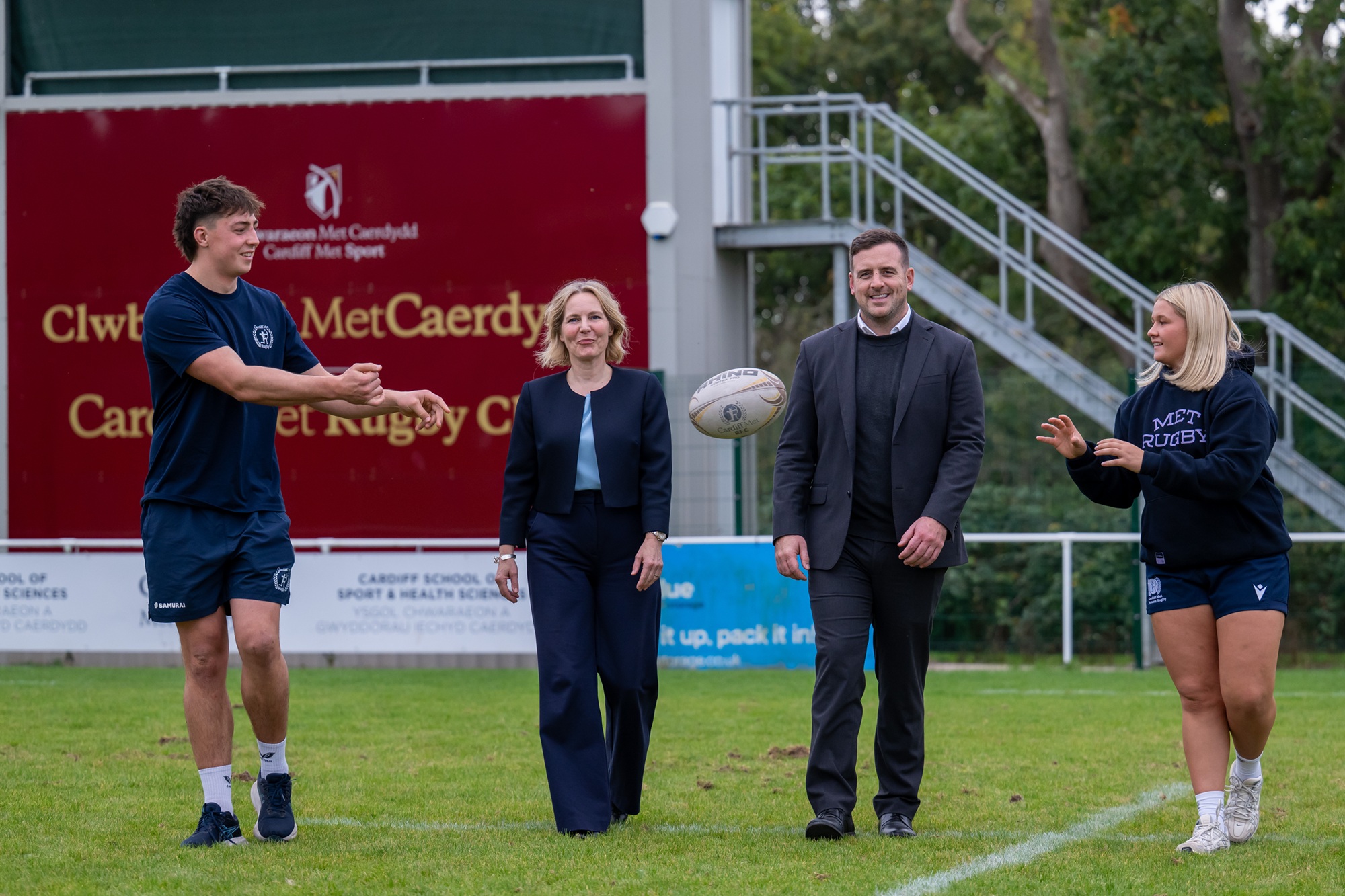 From left to right: Arthur Moore, Cardiff Met Men's Club Captain and BUCS Super Rugby squad player, Professor Rachael Langford, VC of Cardiff Met, Rhys Blumberg, CEO of Dragons RFC and Amelia Bailey, Cardiff Met women's performance squad and BUCS Super Rugby player.