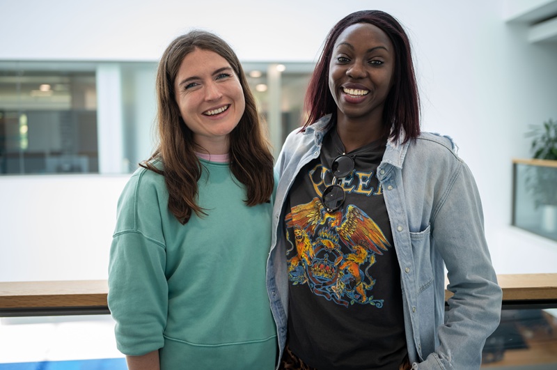 Two adults learners pose for a photograph