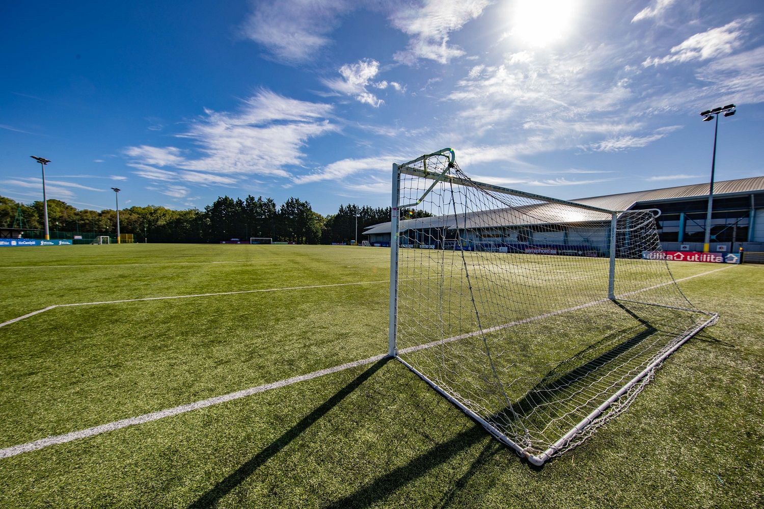 A view from behind one of the goals on the 3G football pitch on a sunny day